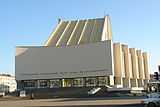 Blocky, somewhat modern light-colored building