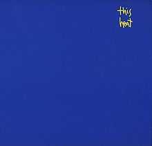 A blue background with the words "This Heat" written in small, yellow handwritten font in the top-right quarter of the image.