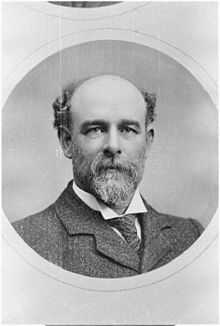 Portrait photo of Thomas Henry Davey, showing him with a bald head and a full beard