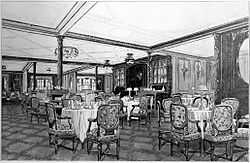 View of an ornate wood-panelled restaurant. Tables with four or five cushioned chairs are visible around the scene, with rolled napkins and table lamps set out on the table tops.