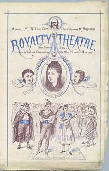 A programme cover for the Royalty Theatre printed in black and blue with engraved illustrations and decorations. There is a large illustration of the main attraction, La Périchole, but caricatures of Gilbert and Sullivan as cherubs frame a portrait of Selina Dolaro.