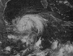A picture of a tropical storm, it looks like a large area of clouds