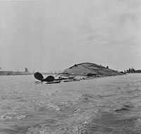 USS Oklahoma overturned, 7 December 1941.