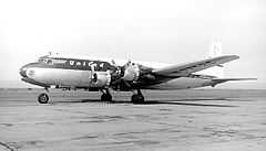 A photograph of a United Airlines DC-6 aircraft with four propellers on the ground in the 1950s
