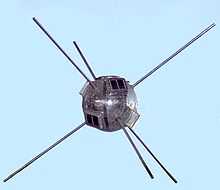Small, round satellite with six rod antennas radiating from it