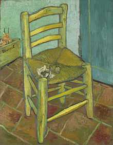 A chair with a pipe and a heaping of tobacco in it on a tiled floor with a box in the background that reads "Vincent" and two walls meeting in a corner behind the chair