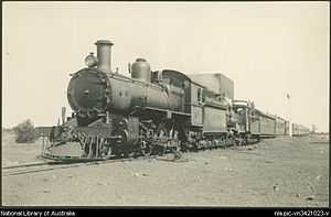 E300 and Ra174 heading the down Kalgoorlie Express at Bullabulling, Western Australia, ca. 1930s.