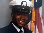 Portrait photo of Walter Scott in U.S. Coast Guard uniform with an American flag partially visible in the background.