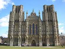 The facade of Wells, unlike Exeter, presents a unified and balanced composition. However, the towers look truncated because they were intended to have spires that were not built.