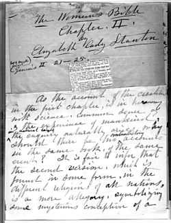 A monochrome photograph of a manuscript page, with a small clipping from a copy of the Bible pasted onto the center, and quill pen cursive writing above and below the clipping stating the name of the book-in-progress, the author, the chapter, and the beginning of the chapter text