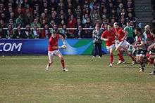 O'Gara in the standoff position passes the ball away from a breakdown.