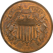 A bronze coin with a shield in the center, dated 1865.