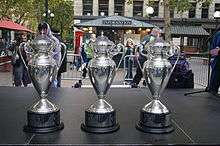 Three silver trophies on display