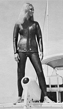 Woman modeling 1960s vintage two-piece wetsuit