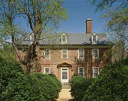 Photo of a three-story brick house