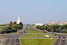 View of city street with a bicycle race