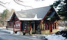 A single-story Tudor Revival railroad station