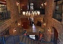 Interior of a large building with a staircase and elevator