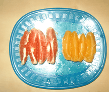 Slices of common and cara cara oranges on a plate