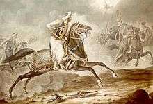 A mounted man on a dark horse attacking a line of mounted men