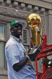 Kevin Garnett holding the 2008 Celtics' Larry O'Brien Trophy