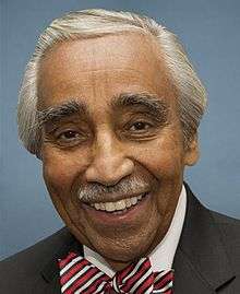 Official photograph of Charles Rangel dressed in suit and tie against a blue background