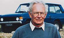 Charles Spencer King with one of his designs, the Range Rover, in the background