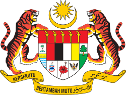 Shield showing symbols of the Malaysian states with a star and crescent above it and a motto below it supported by two tigers