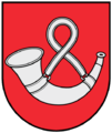 A coat of arms depicting a rounded, silver horn hung up by a rounded, silver strap all on a solid red background bordered by a black line