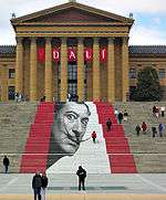 Entrance display for the 2005 Salvador Dalí exhibition showing Dalí's face on the steps of the museum