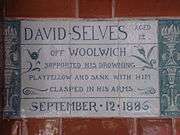 A tablet formed of six standard sized tiles, bordered by green flowers in the style of the Arts and Crafts movement