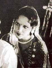 A black-and-white portrait of a woman smiling at the camera