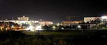 A night scene of a building complex.