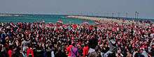 Seaside demonstration, with protesters wearing red, white and blue