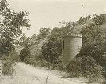 Old black and white photo of brick tower