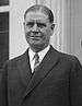 Upper-body portrait of an early-twentieth-century man in a suit.