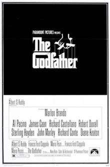 The Godfather written on a black background in stylized white lettering, above it a hand holds puppet strings.