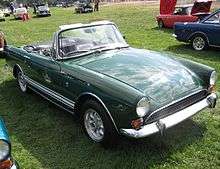 Dark-green open-top sports car