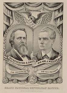 Sepia-toned picture of two men; one bearded, one clean-shaven
