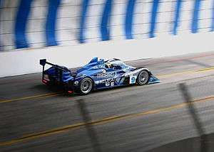 An Acura sports car on a street circuit