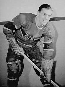 Richard poses for a photographer while wearing his full Canadiens uniform