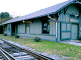 Rear view of Holland Patent Railroad Station, showing train tracks.