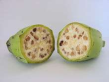 Photo of two cross-sectional halves of seed-filled fruit