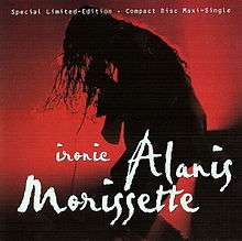 An unseen woman singing and bending down with the microphone. The background is red lights with shadows, and the words "Alanis", "Morissette" and "Ironic" are written in white cursive letters at the bottom half of the image.