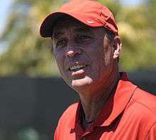 A man in a red cap and shirt