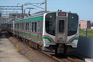 An E721 series train pulling into Nagamachi Station on the Tohoku Main Line