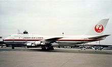 Side view of aircraft on airport tarmac