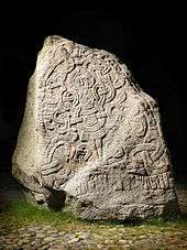 Large stone containing a carved depiction of Jesus Christ