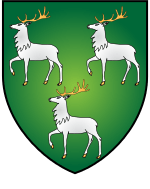  A shield displaying a coat of arms. A green background with three white stags (two above one) facing left, with their front right feet raised