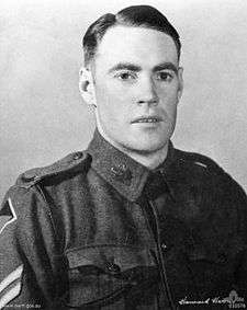 A portrait photo of a corporal in service dress uniform